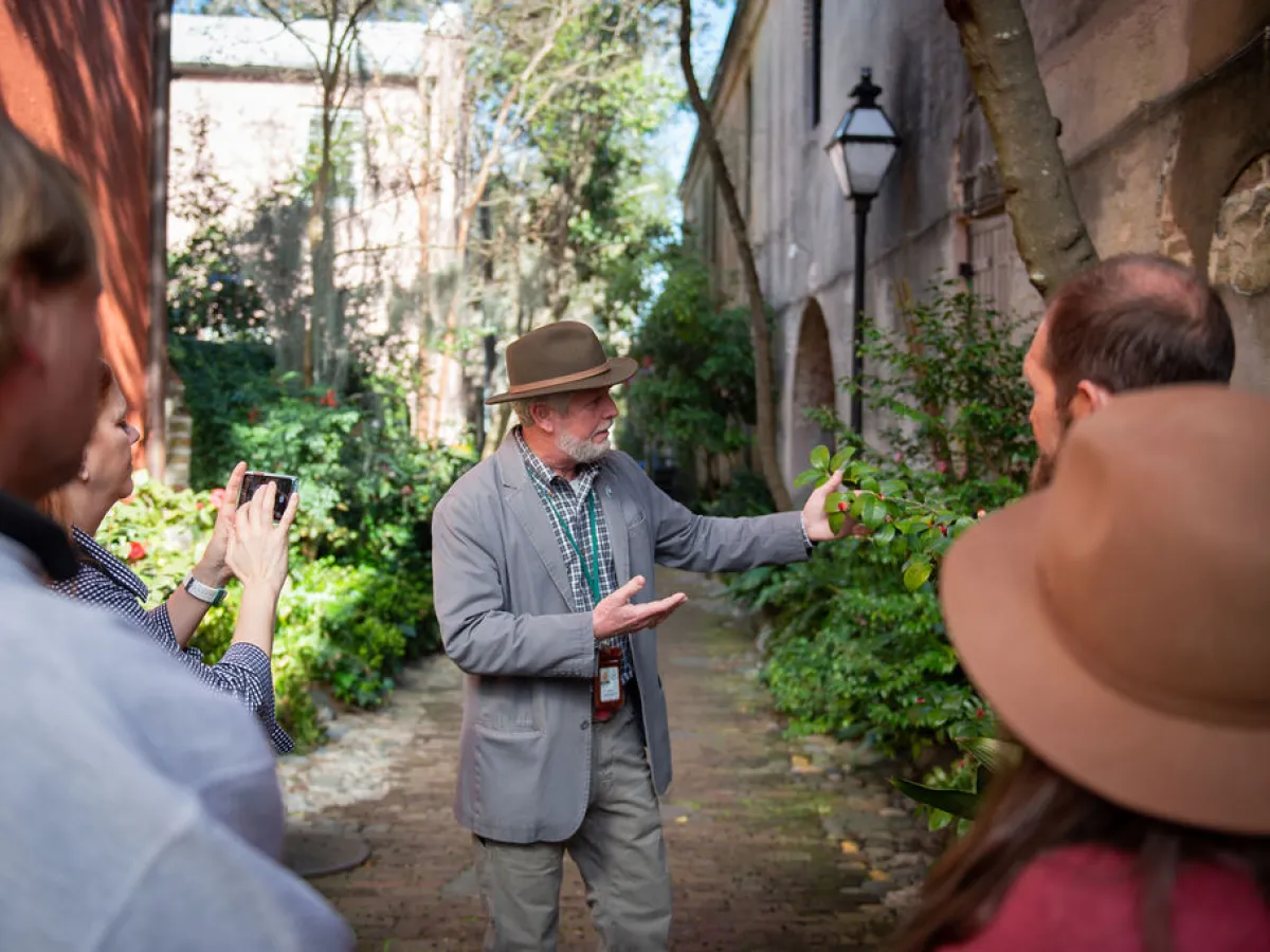 a group of people looking at a cell phone