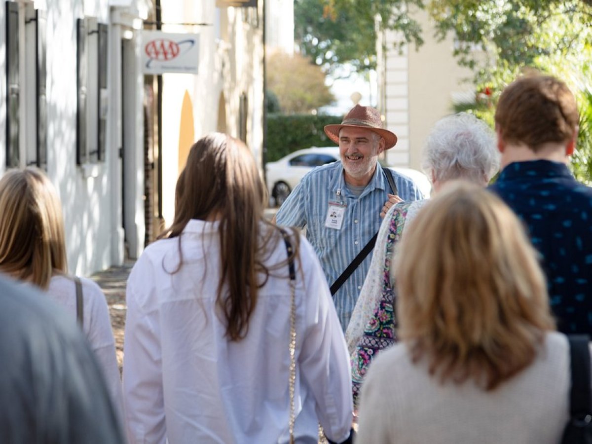 a group of people standing next to a person
